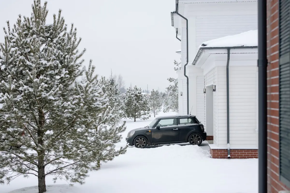 Fresh overnight snow on a quiet residential street — the mornings winter service is built for